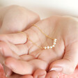 Model Holding Freshwater Pearl Chain Necklace in Gold