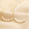 Freshwater Pearl Chain Necklaces in Gold and Silver Side by Side on Beige Fabric