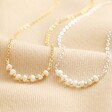 Freshwater Pearl Chain Necklaces in Silver and Gold Side by Side on Beige Fabric