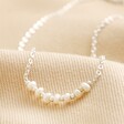 Close Up Freshwater Pearl Chain Necklace in Silver on Beige Fabric