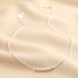 Freshwater Pearl Chain Necklace in Silver on Beige Fabric