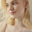 Model Wearing Mixed Metal Crystal Double Star Pendant Necklace in Silver Looking to Side