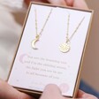 Mother & Child Set of 2 Sun and Moon Necklaces in Gold in Box Packaging Held by Model