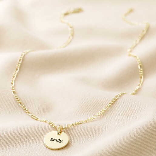 Personalised Name Disc and Figaro Chain Necklace Full Length on Beige Material