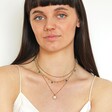 Semi-Precious Jade Stone Droplet Necklace in Gold on model in curated look