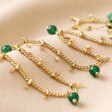 Semi-Precious Stone Green Beaded Droplet Necklace in Gold Layered on Beige Fabric