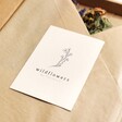 Brand card from the Dried Wildflowers and Trio of Vases Gift Set on top of packaging