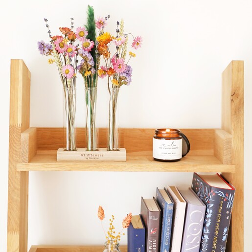 Dried Wildflowers and Trio of Vases on wooden shelves with candle and books