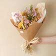 Model Holding Spring Meadow Dried Flower Bouquet