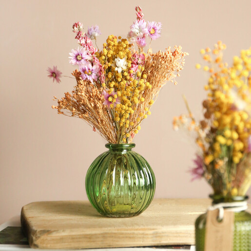 Spring Meadow Dried Flower Posy Arranged in Green Glass Vase on Beige Background