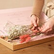 Model Holding Stems from Long Stem Vintage Pink Dried Flower Letterbox Bouquet