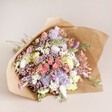 Wrapped Luxury Pastel Dried Flower Bouquet on Flat Surface