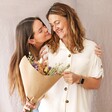 Mother and Daughter Holding Luxury Pastel Dried Flower Bouquet