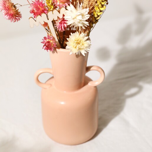 Close Up of Mum Yellow and Pink Small Dried Flower Bouquet Inside Pink Vase