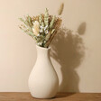 Natural Dried Flower Posy Bouquet Letterbox Gift Arranged in Ceramic Vase on Natural Coloured Background