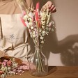 Model Arranging Vintage Pink Market Style Dried Flower Bouquet in Vase