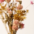 Close Up of Flowers From Yellow and Pink Dried Flower Posy with Vase
