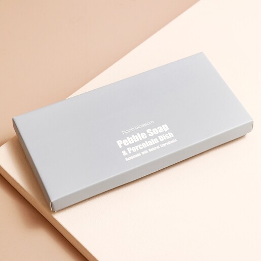 Top of Box Hana Blossom Wellness Pebble Soaps Closed Box on Neutral surface