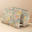 Ditsy Floral Cotton Pouch with Washbag on Pink Backdrop