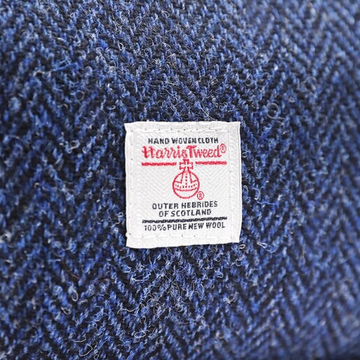 Close up of certification label on the navy Personalised Harris Tweed 100% Wool Wash Bag