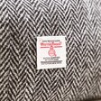 Close up of certification label on the grey Personalised Harris Tweed 100% Wool Wash Bag