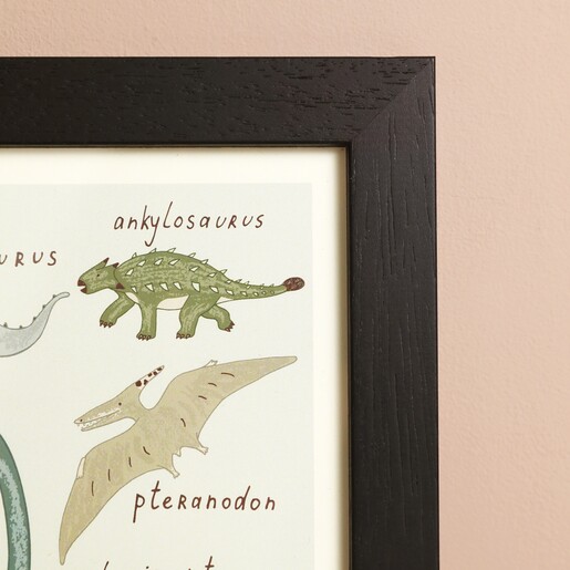 Close up of ankylosaurus and pteranodon dinosaur illustrations on Dose of Dinosaurs A4 Framed Print