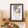 Wooden A4 Photo Frame in Black with tarot card print inside on wooden shelf 
