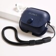Personalised AirPods Pro 2nd Generation Soft Vegan Leather Case in Navy on white surface with AirPods in background