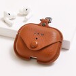Personalised AirPods Pro Soft Vegan Leather Case in Tan on white surface with AirPods in background