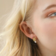 Model Wearing Mismatched Pearl and Organic Shape Stud Earrings