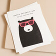 The Art File Coolest Dad Bear Father's Day Card on top of envelope against beige backdrop