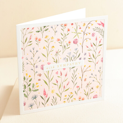 The Art File Floral Sympathy Greetings Card standing up against beige coloured background