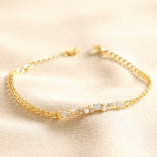 Crystal and Pearl Bar Bracelet in Gold on top of beige coloured fabric