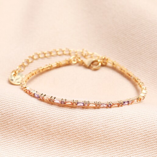 Pastel Baguette Crystal Bracelet in Gold Pastel Baguette Crystal Bracelet in Gold on beige Fabric