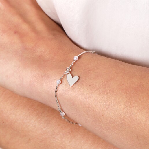 Close Up of Beaded Pearl Heart Charm Bracelet in Silver on Model