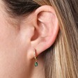 Green Teardrop Crystal Huggie Hoop Earrings in Gold on Model