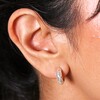 Close up of Small Crystal Hammered Half Hoop Earrings in Silver on model