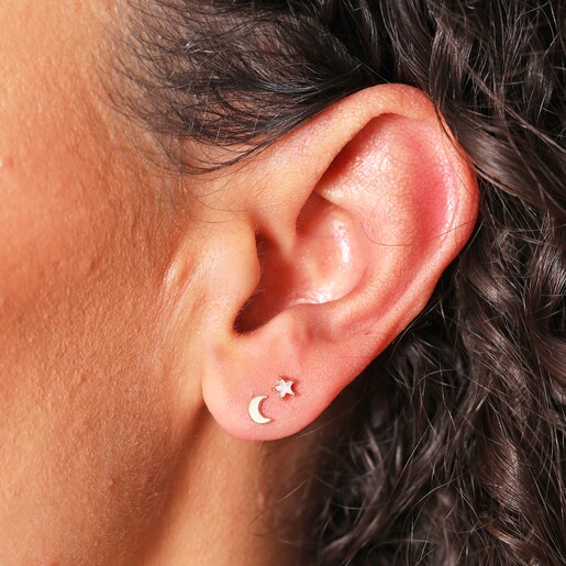 Close Up of moon and star from Set of Four Hamsa Hand, Moon and Star Stud Earrings in Gold on Model