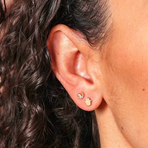 Close Up of Model Wearing crystal moon and hamsa hand from Set of Four Hamsa Hand, Moon and Star Stud Earrings in Gold