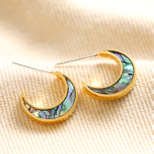 Shell Crescent Moon Hoop Earrings in Gold on top of beige coloured fabric