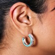 Close Up of Teal Stone Hammered Hoop Earrings in Silver on Model's Ear