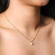 Close Up of Blue Enamel Heart Pendant Necklace in Gold on Model