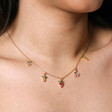 Close up of Colourful Crystal Fruit Charm Necklace in Gold on model