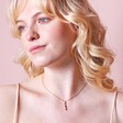Colourful Gemstone Bar Pendant Necklace in Gold on model in front of neutral coloured backdrop