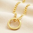Large Halo Clasp Pendant Necklace in Gold on Beige Fabric
