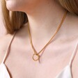 Close up of Large Halo Clasp Pendant Necklace in Gold on Model