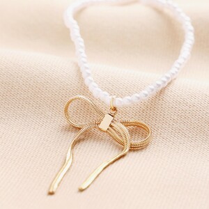 Pearl Bow Necklace in Gold