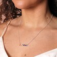 Close Up of Rainbow Crystal Baguette Bar Necklace in Silver on Model