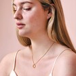Model Wearing Small Halo Clasp Pendant Necklace in Gold 