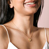Sunbeam Heart Pendant Necklace in Gold on model smiling against beige coloured backdrop